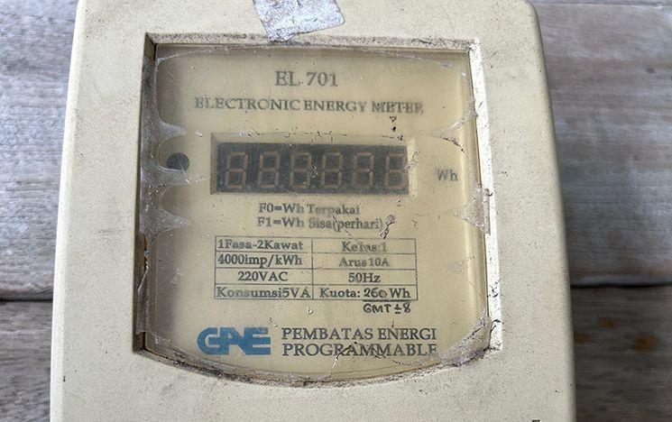 Close up of electric meter screen with text and digits