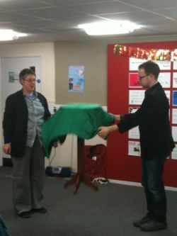 Max performs his magical flying table trick at the Staging Illusion conference party, assisted by Sally Munt.