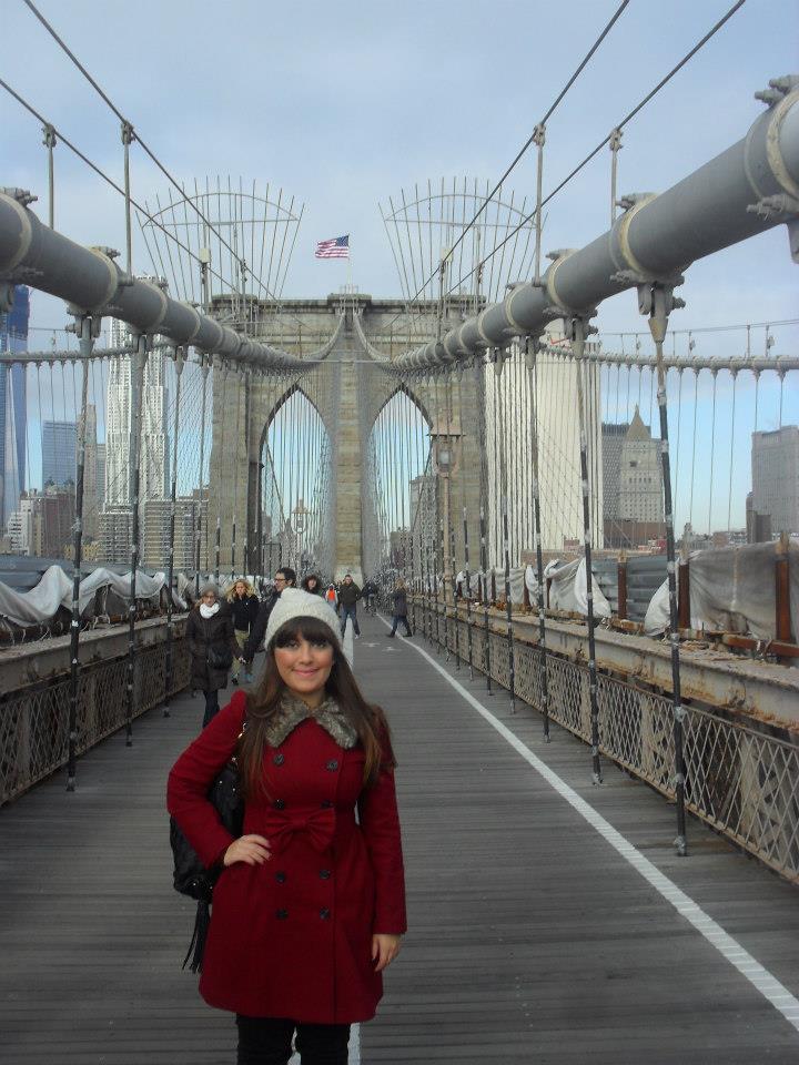 Student smiling on Brooklyn Bridge