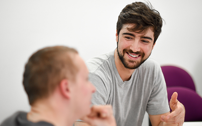 A Sussex First-Generation Scholar talking to an employer