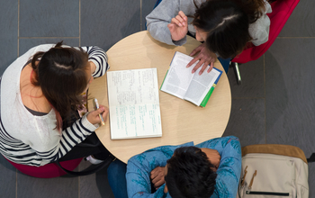 Students studying at a table