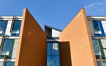 The entrance to the Jubilee building looming up against a blue sky