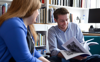 A PhD student discusses her work with an advisor
