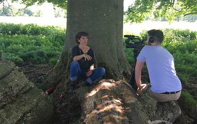 Person sitting under a tree