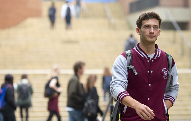 Sussex student walking on campus