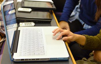 Girl looking at a laptop