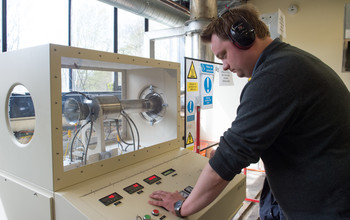 A researcher working on an engine in the Department of Engineering at the University of Sussex