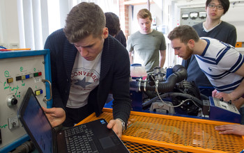 Researchers working on engineering equipment