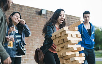 Students taking part in a game which is part of the social programme at Sussex over the summer