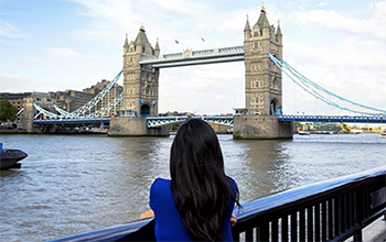 A student looking at Tower Bridge in the UK capital, London