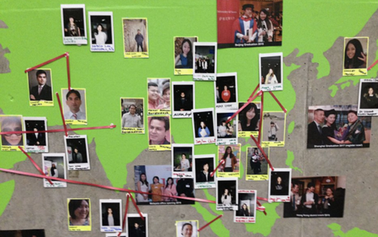 Photos of volunteer alumni consuls on wall map