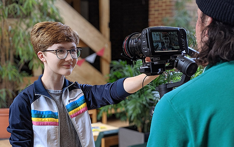 A videographer at a filming shoot at the University of Sussex