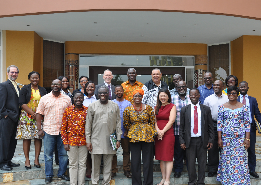 A delegation of Ghanian staff in front of a University of Ghana building