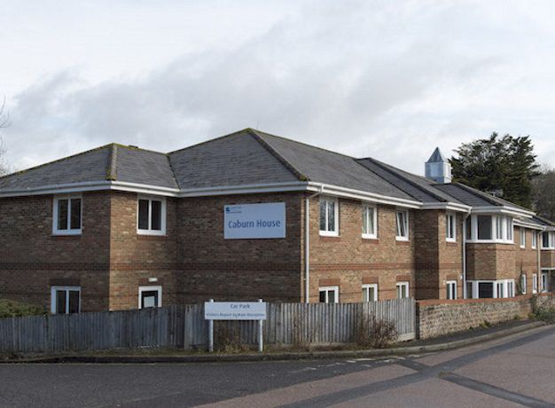 Exterior of caburn house on a cloudy day