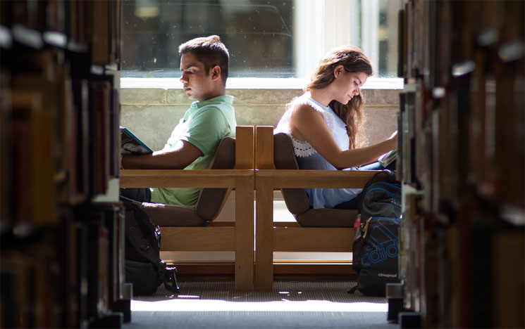 Students smiling and enjoying a lecture