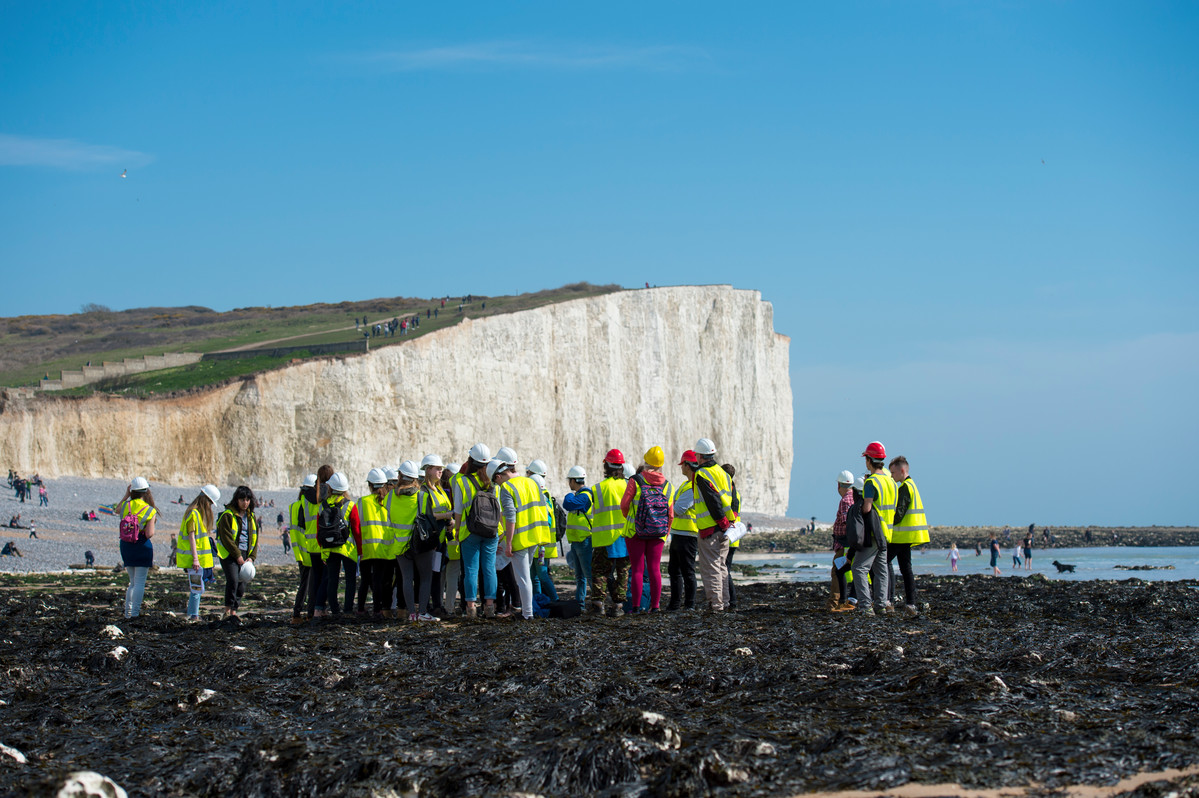 Students on a geography field trip at the coast