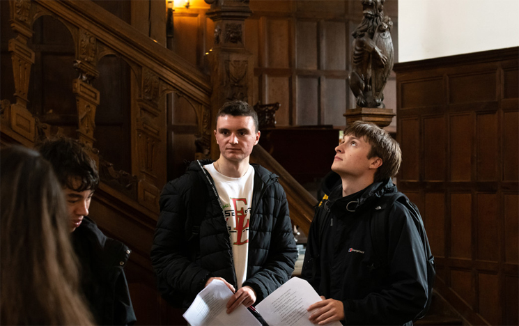 Students on a history field trip at a castle