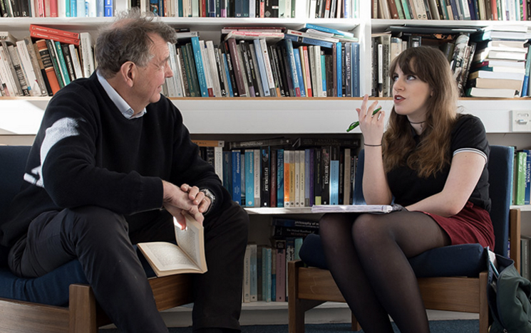 Student talking to a lecturer at the University of Sussex