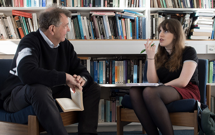 Student talking to a lecturer at the University of Sussex