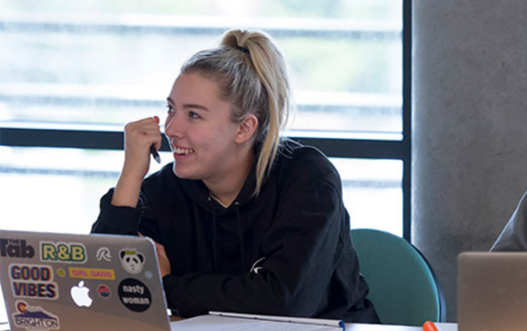 Student in a seminar at the University of Sussex