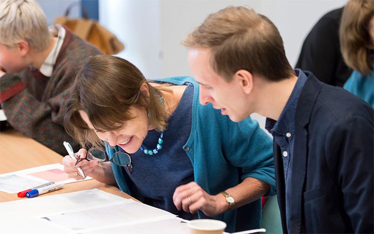 Two people taking part in an activity as part of social work seminar