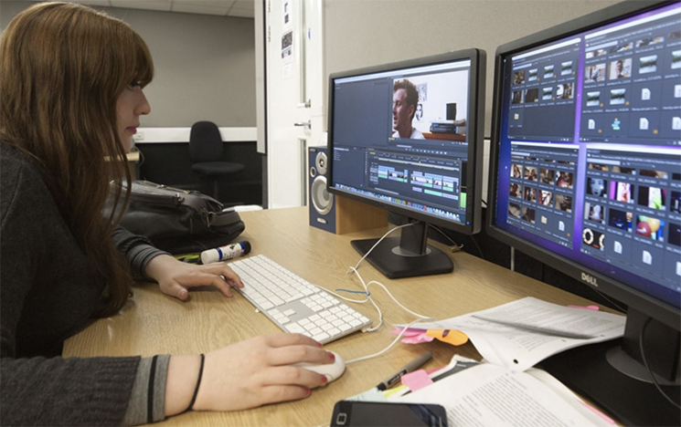 A student uses editing software
