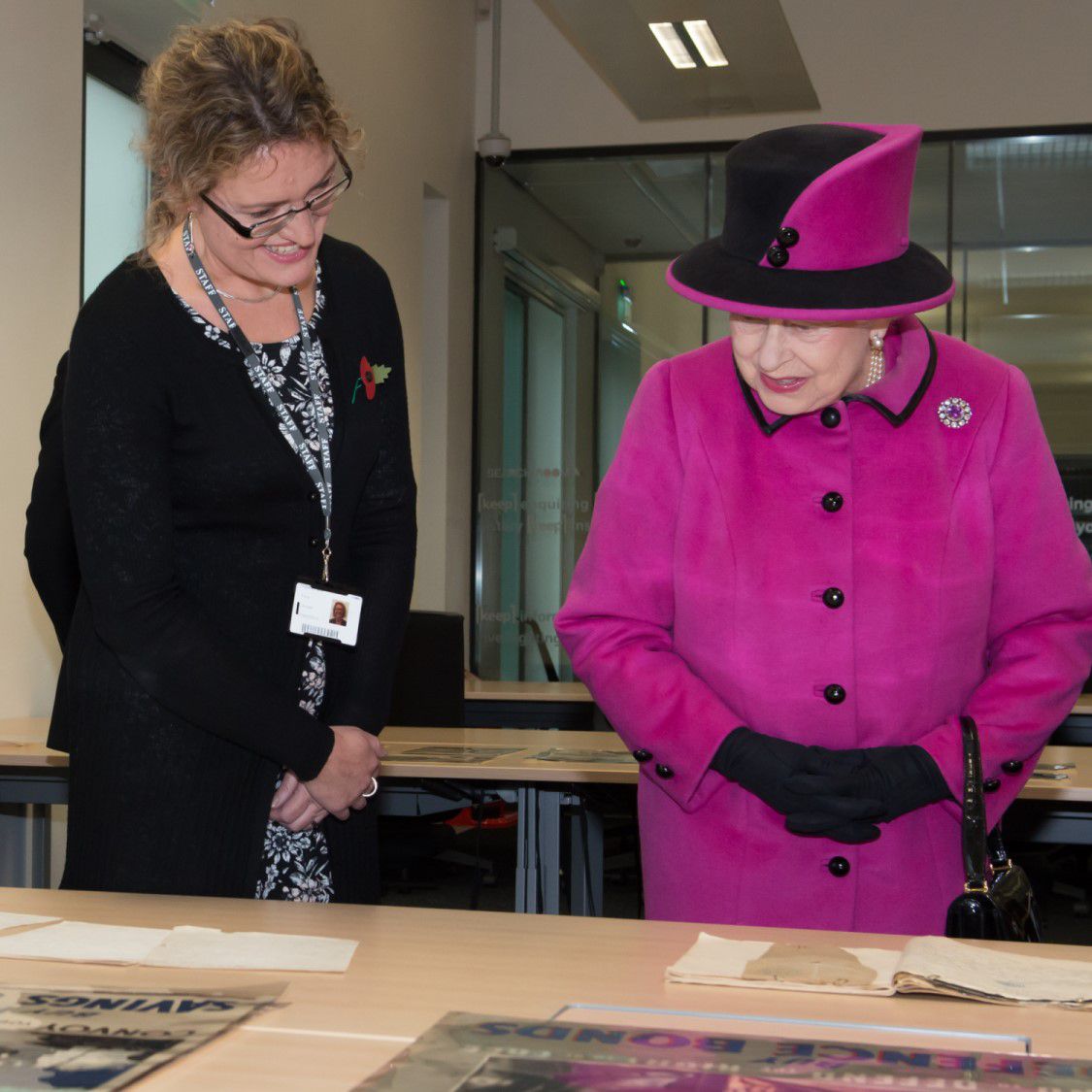 Dr Fiona Courage shows Her Majesty more of the University's Special Collections archives