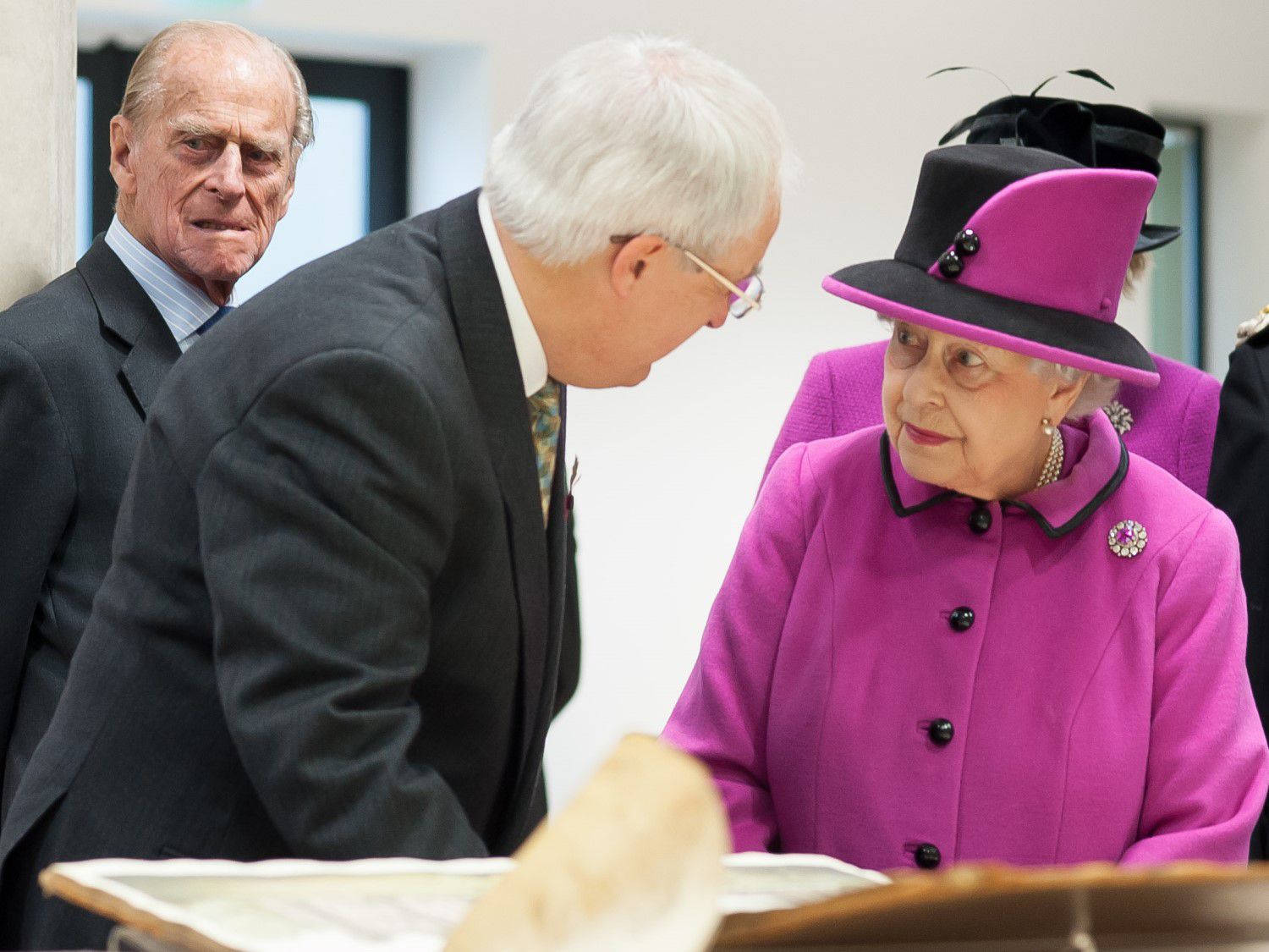 Chris Whittick, Senior Archivist at East Sussex County Council, shows Her Majesty items from The Keep's archives