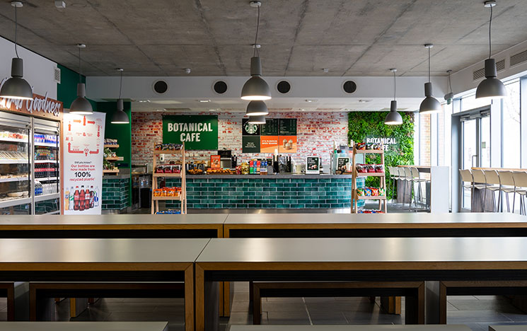 The interior of the Botanical cafe showing the the counter and parts of the seating area.