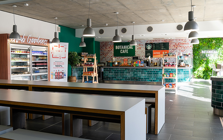 A picture of the interior of the Botanical cafe showing the counter and parts of the seating area