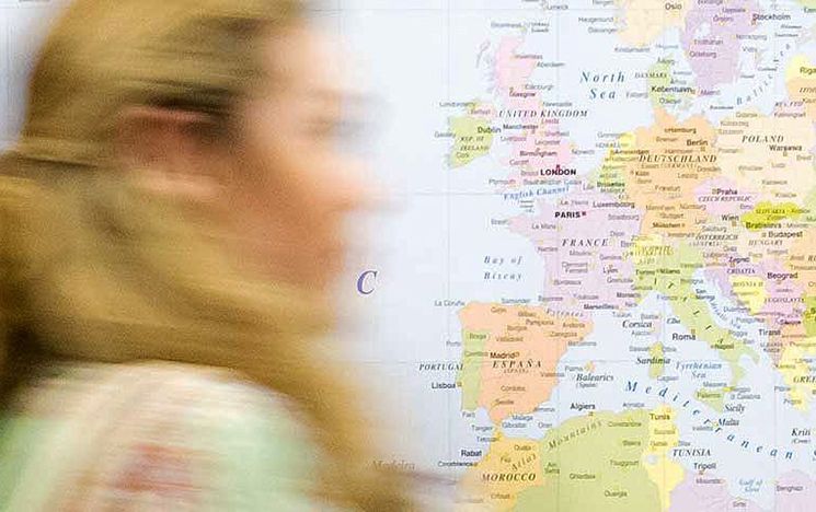  A blurred face in front of a map of Europe