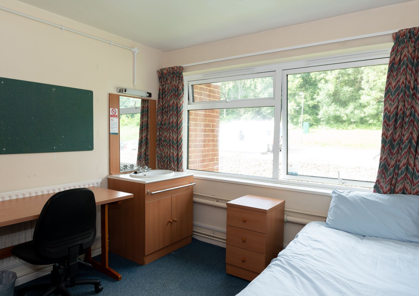 Norwich House accommodation bedroom desk and sink area