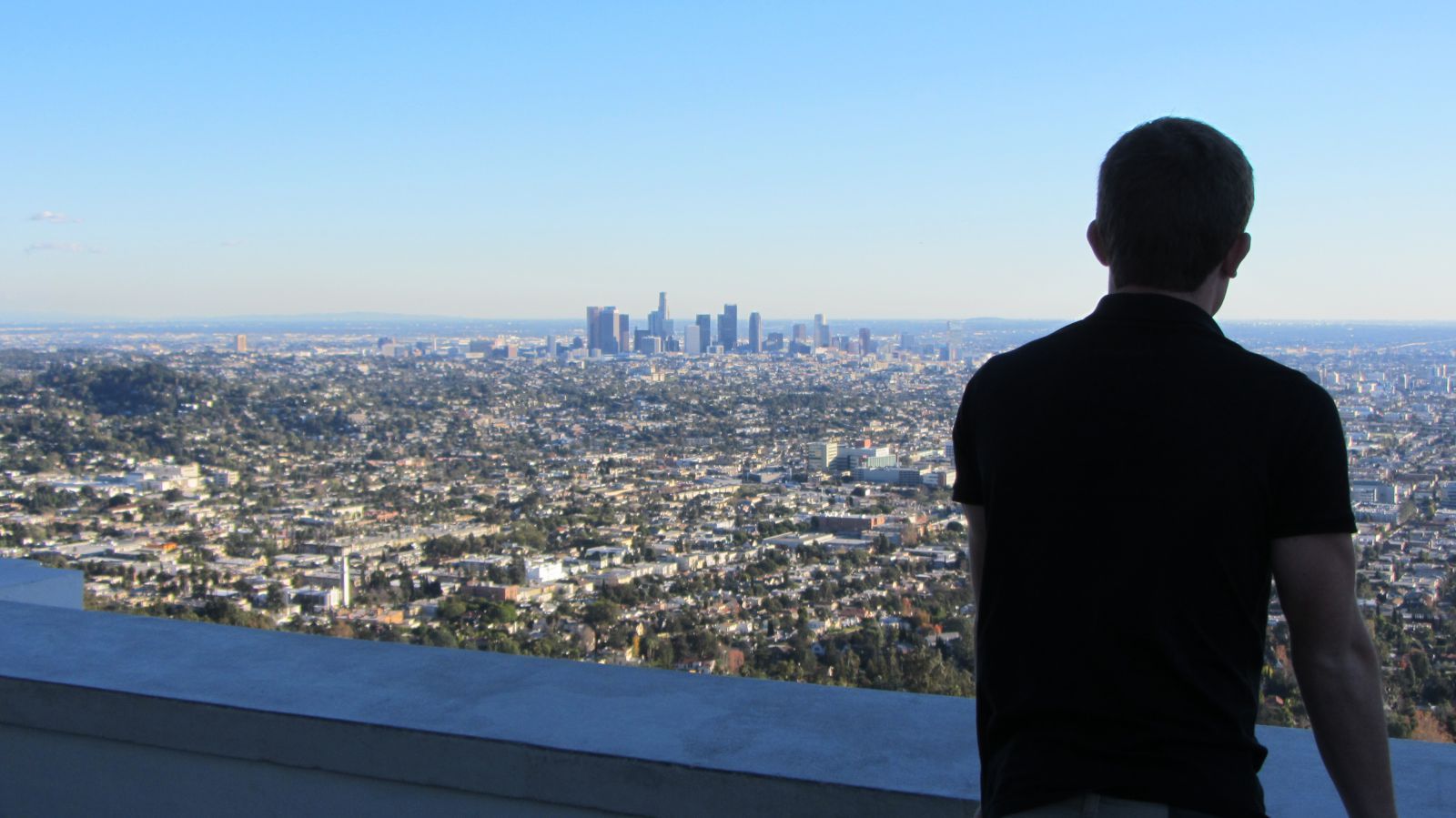 Student looking out over city skyline