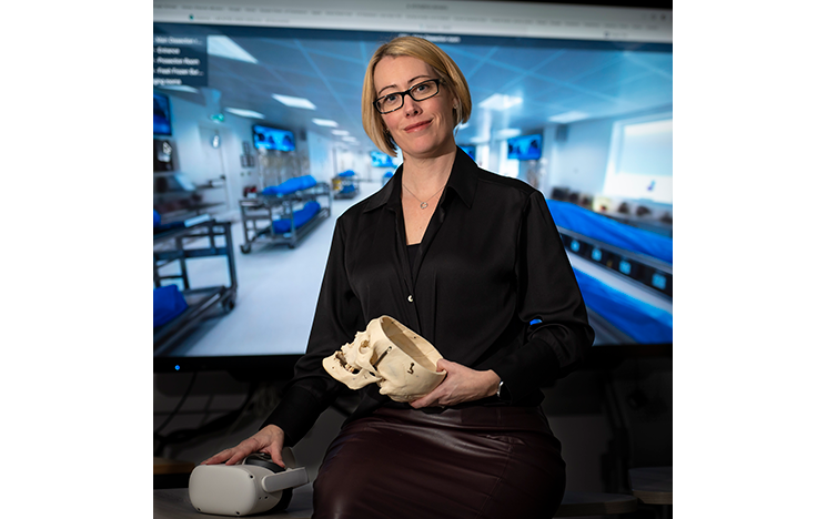 

Image of Claire Smith holding skull model
