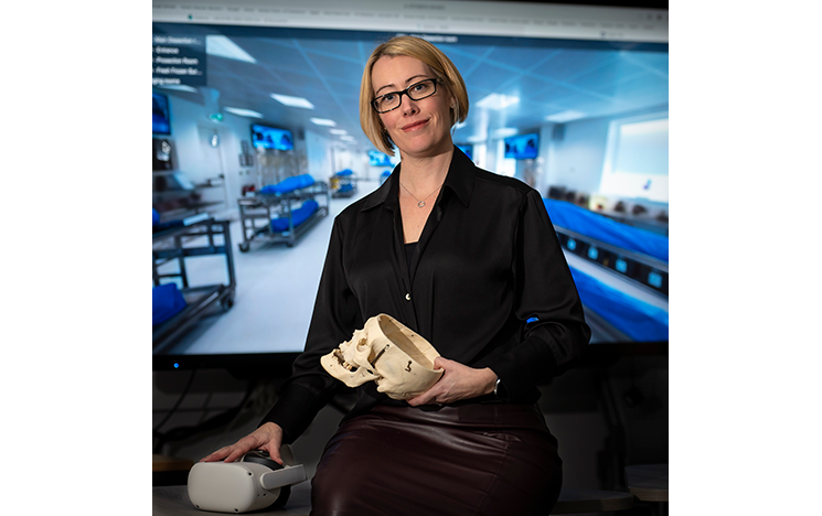 

Image of Claire Smith holding skull model