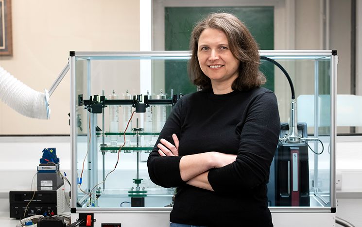 

Image of Esra Sorguven stood in front of machinery