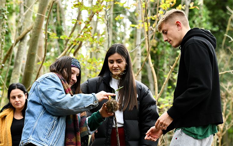 Students smiling and enjoying a lecture