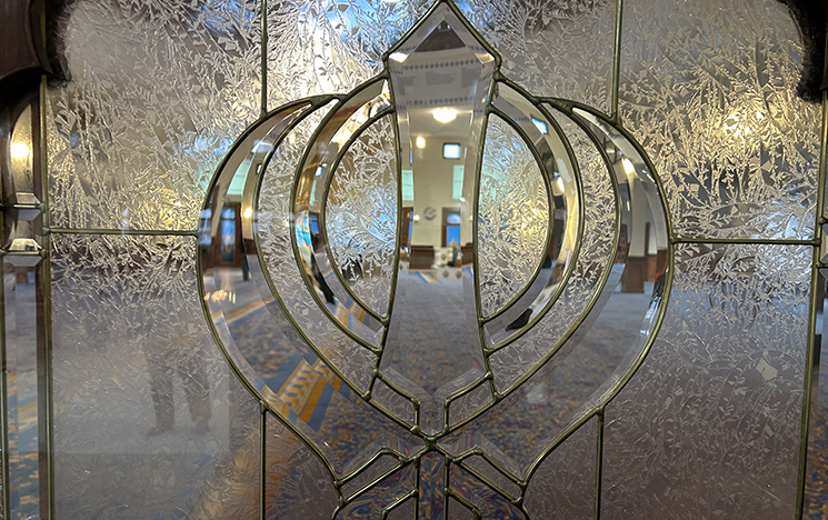 A khanda - Sikh emblem representing spiritual and worldly forces of the soul - on a gurdwara door