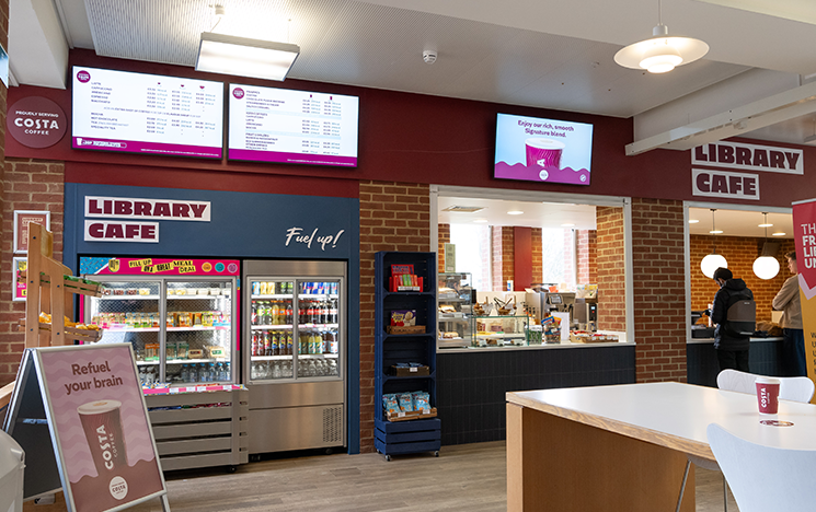 Interior of the library cafe showing a brightly lit counter