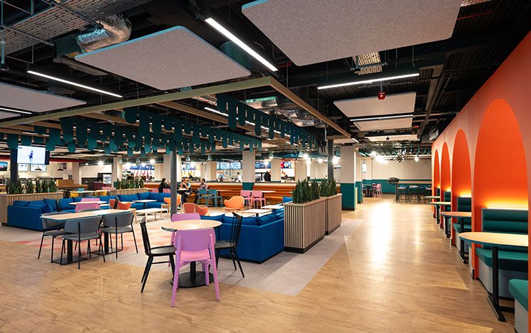 The interior of Eat Central showing the seating area with tables and chairs