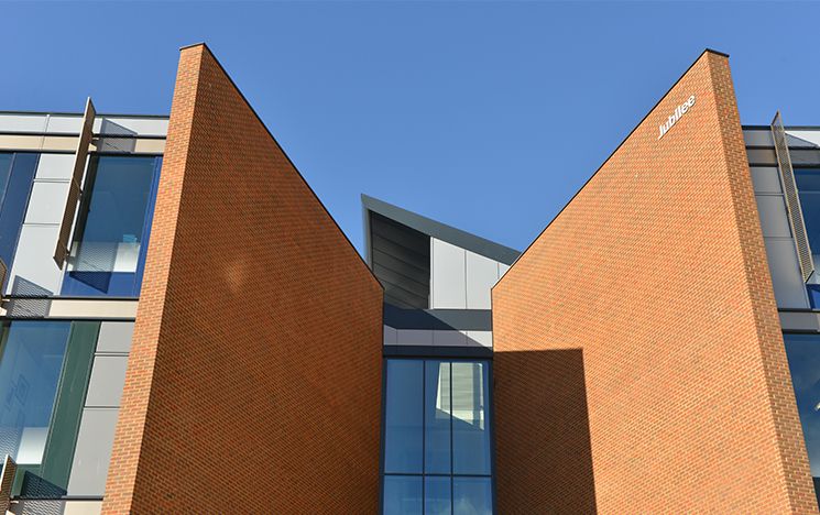 The entrance to the Jubilee building looming up against a blue sky