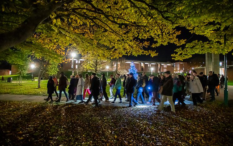 A lantern-lit singing walk from the library on campus to The Swan Inn in Falmer village
