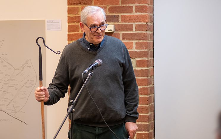 Mike Tristram, Chair of Sussex Traditions, stood talking at a microphone