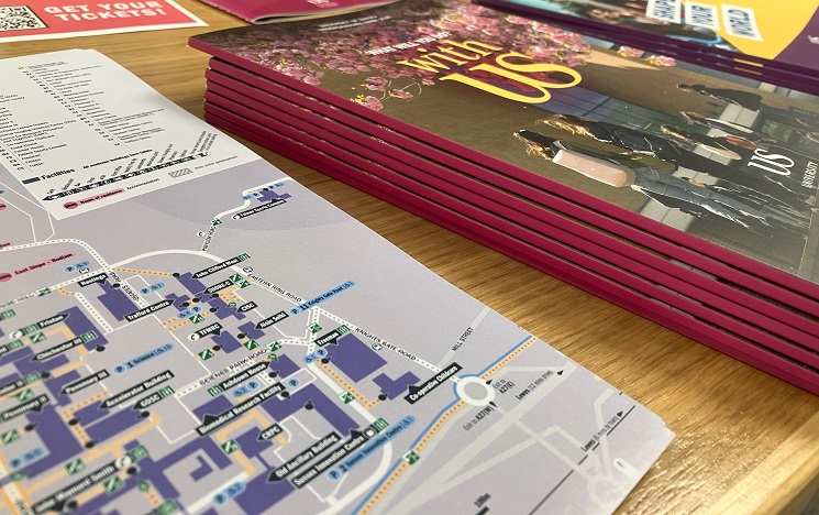 A stack of printed maps, brochures and leaflets