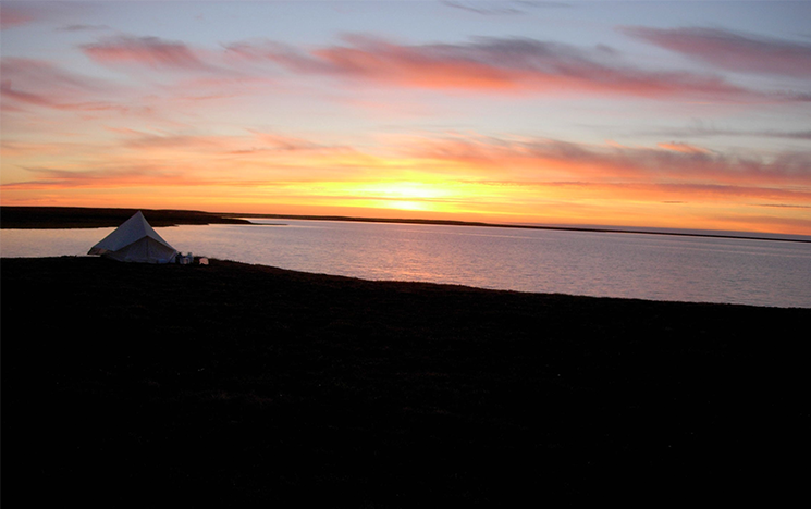 The sun going down over the Tuktoyaktuk Peninsula, Arctic Canada