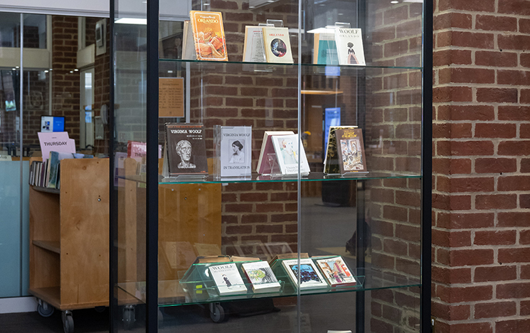 A tall glass display cabinet in the main Library area, contains several of Woolf's books in translation