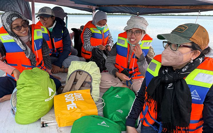 People in lifejackets on a boat