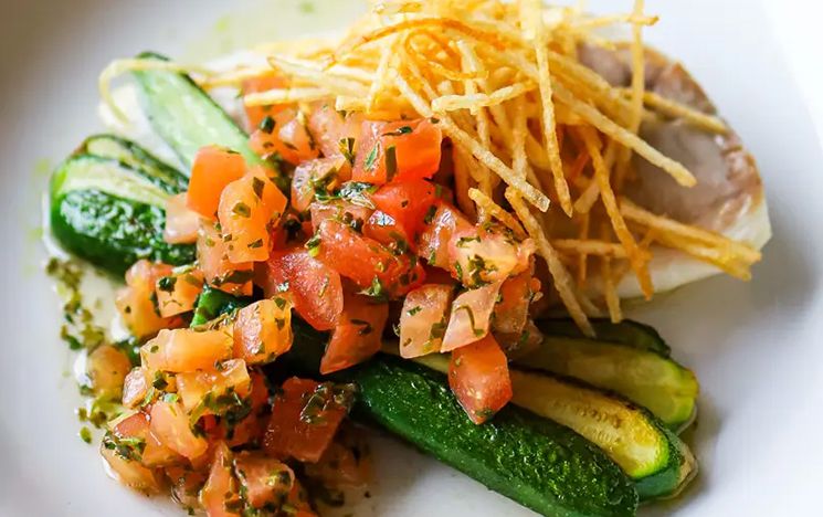 Colourful food stacked on a dish