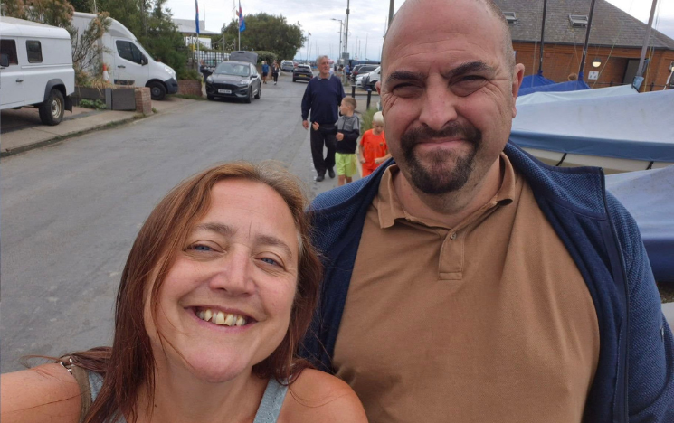 A recent selfie of Joanne and Gareth walking along a road.