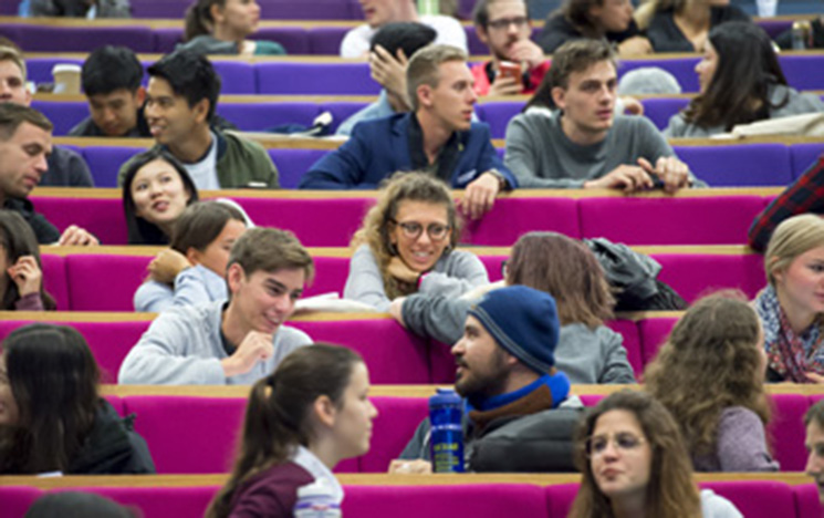 Prospective students in lecture theatre.